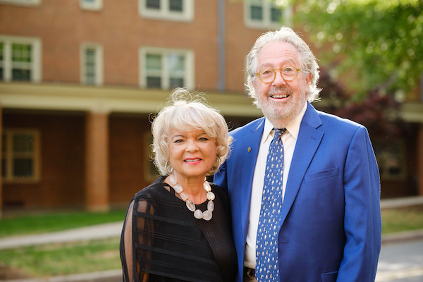 Portrait of J.D. Wilson (’69) and Beth Norbrey Hopkins (’73) in front of the Sutton Center before the 2023 Distinguished Alumni Awards
