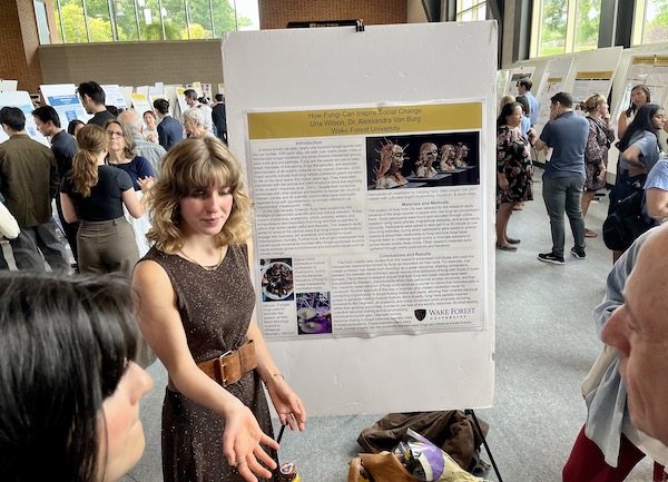 Una Wilson ('24) presents her poster, How Fungi Can Inspire Social Change, at the URECA Day presentations in the Sutton Center